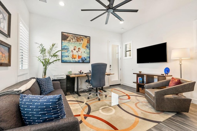 office with ceiling fan and wood-type flooring