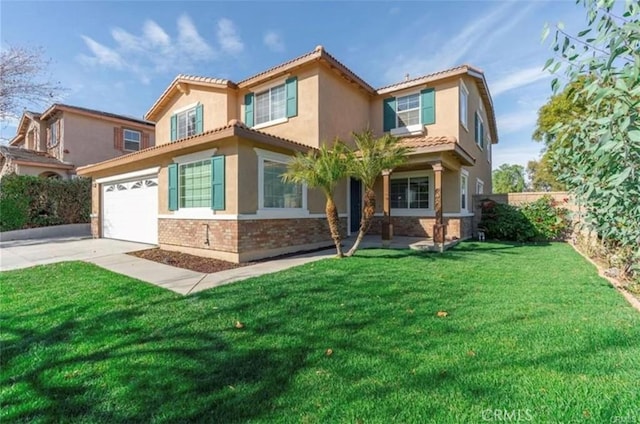 mediterranean / spanish house featuring a garage and a front yard