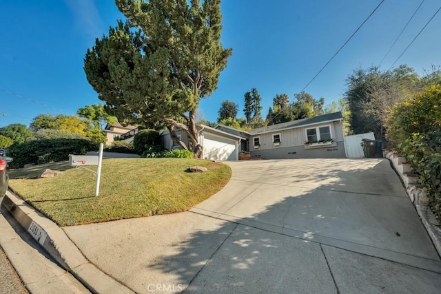 single story home with a garage and a front yard