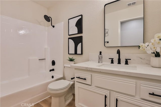 full bathroom with wood-type flooring, toilet, vanity, and shower / washtub combination