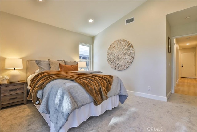 carpeted bedroom featuring vaulted ceiling