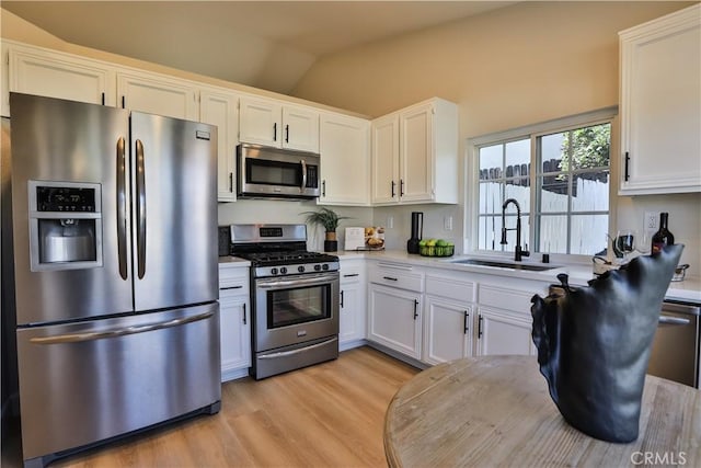 kitchen with white cabinets, sink, and stainless steel appliances