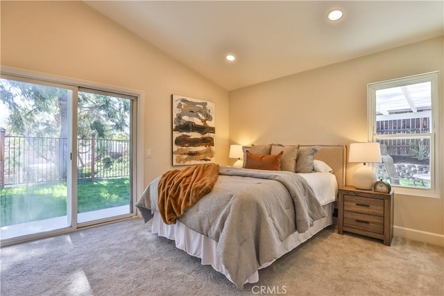 bedroom featuring lofted ceiling, access to exterior, and multiple windows