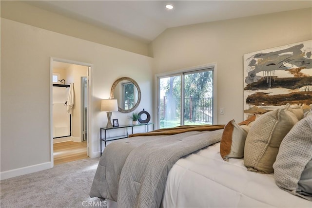 carpeted bedroom with vaulted ceiling