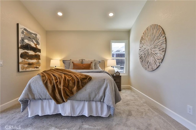 bedroom featuring light colored carpet