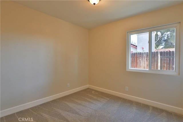 empty room featuring carpet floors