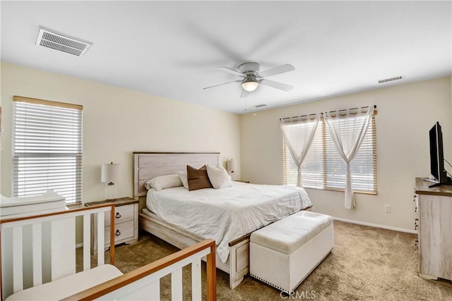 carpeted bedroom featuring ceiling fan