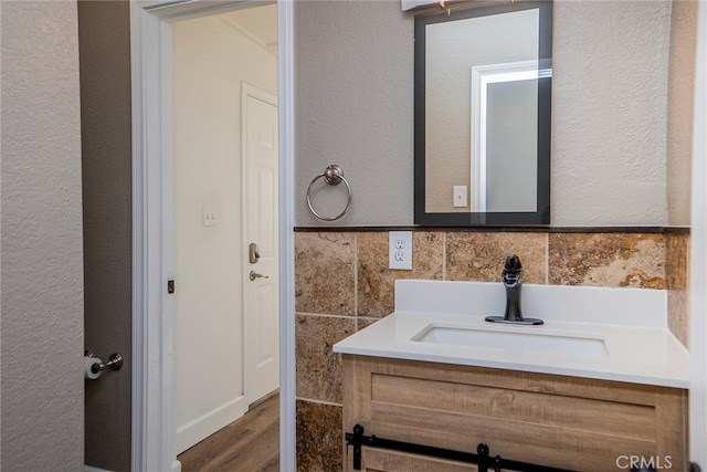 bathroom featuring vanity and hardwood / wood-style floors