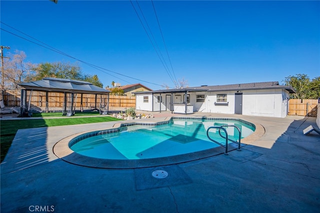 view of swimming pool featuring a patio area and a gazebo