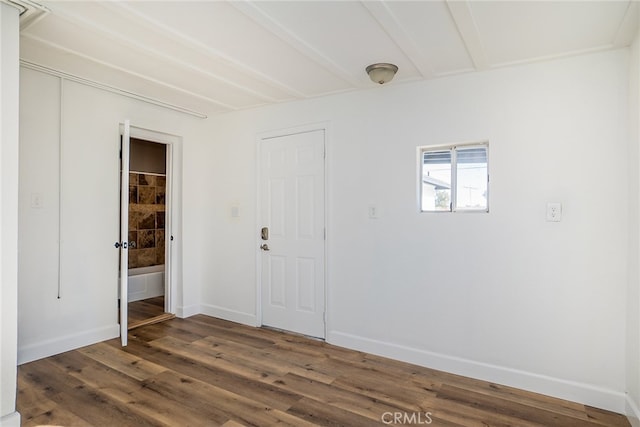 empty room with dark hardwood / wood-style floors