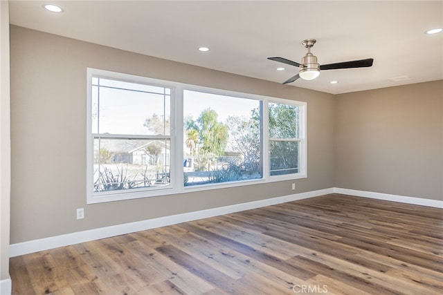 unfurnished room featuring ceiling fan and wood-type flooring