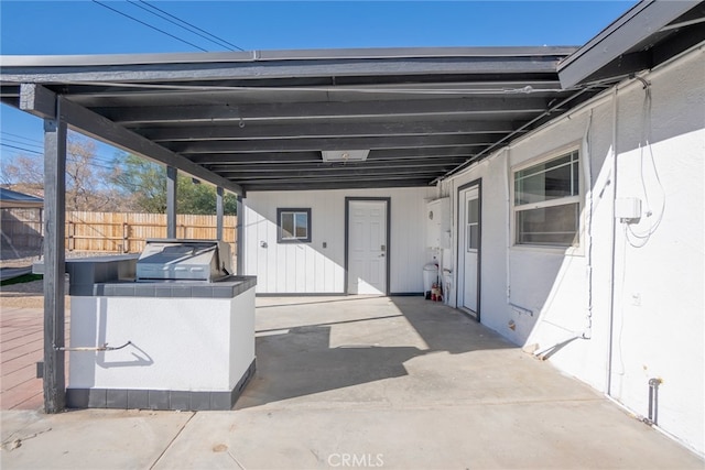 view of patio / terrace with a carport and area for grilling