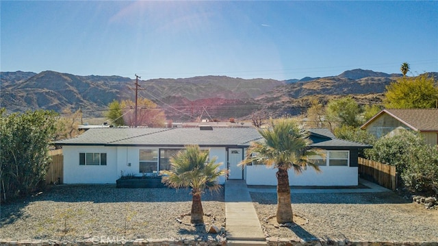 single story home with a mountain view