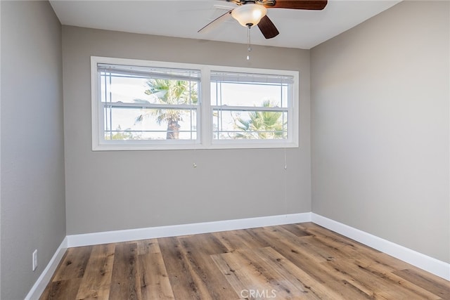 unfurnished room featuring ceiling fan and wood-type flooring