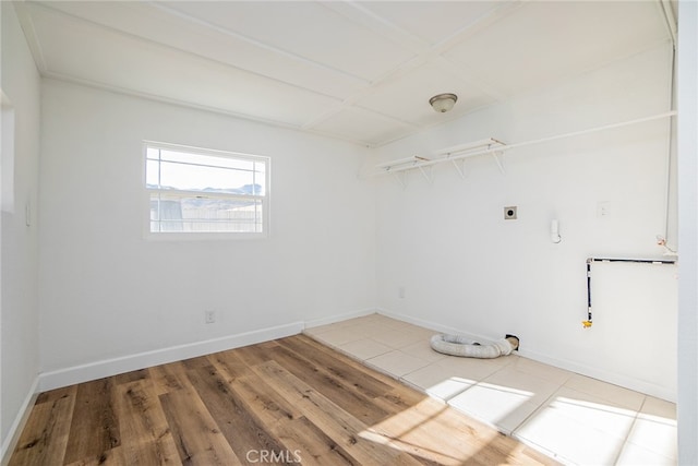 spare room with wood-type flooring