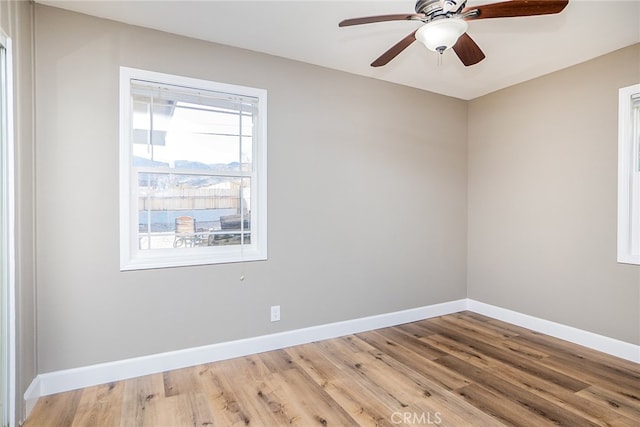 unfurnished room featuring ceiling fan and wood-type flooring