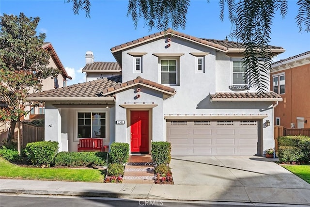 mediterranean / spanish-style home featuring a garage