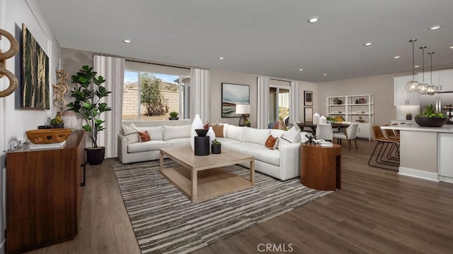 living room featuring dark hardwood / wood-style flooring and a chandelier