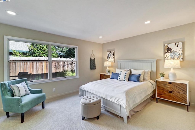 bedroom featuring light colored carpet