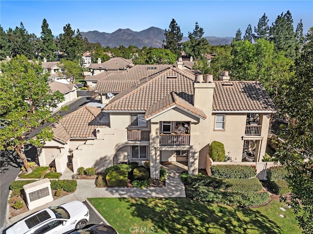 birds eye view of property with a mountain view