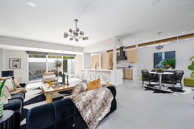 living room with sink and a chandelier