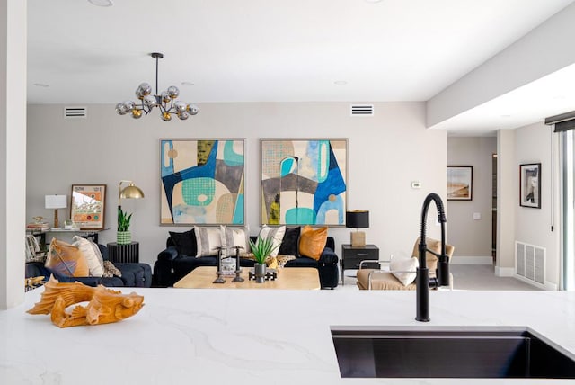 interior space with sink, a chandelier, and pendant lighting