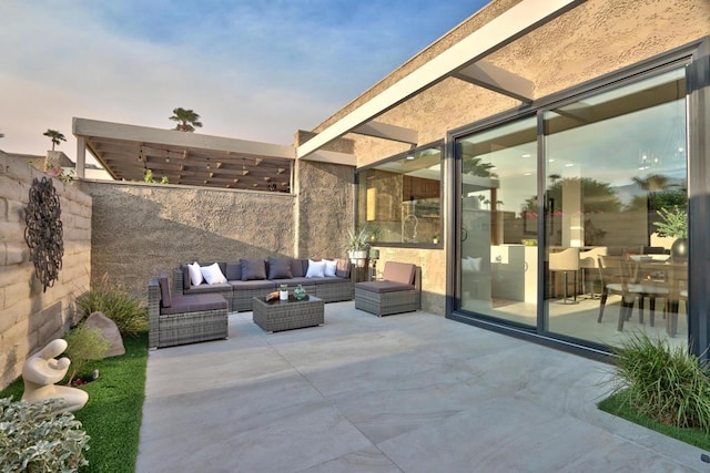 patio terrace at dusk with an outdoor living space