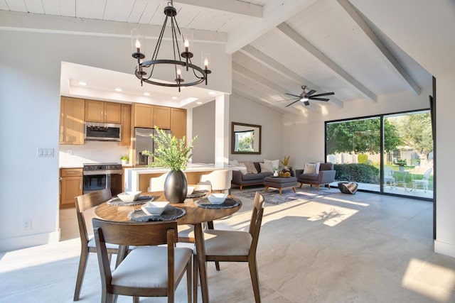 dining area featuring vaulted ceiling with beams and ceiling fan with notable chandelier