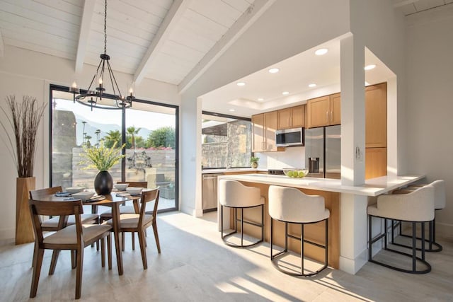 dining room featuring lofted ceiling with beams, wood ceiling, and an inviting chandelier