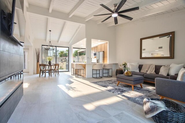 living room featuring ceiling fan with notable chandelier, wood ceiling, beam ceiling, and high vaulted ceiling