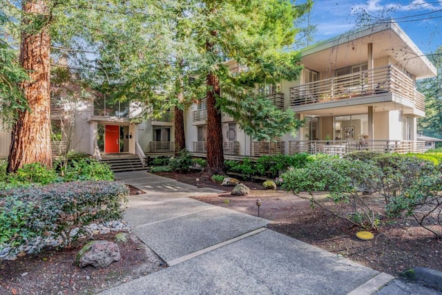 view of front of property with a balcony