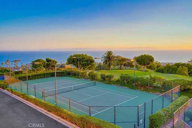 view of sport court featuring a water view