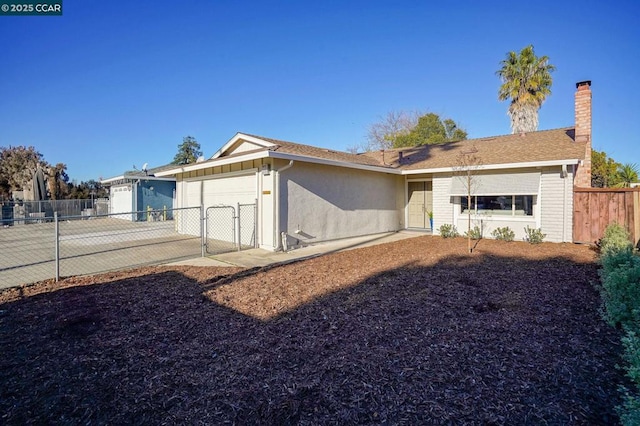 rear view of house with a garage