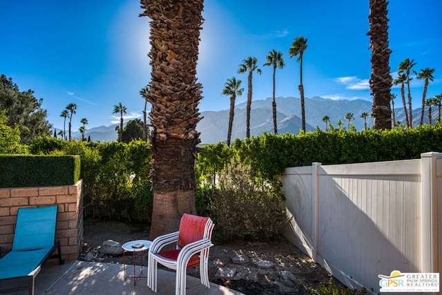 view of patio / terrace featuring a mountain view