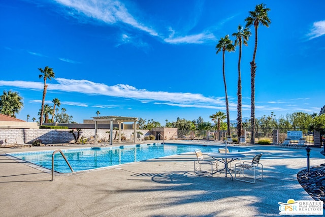 view of pool featuring a pergola and a patio area