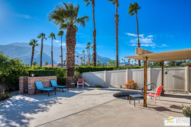 view of patio / terrace featuring a mountain view