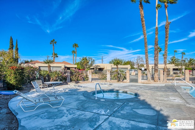 view of pool featuring a community hot tub and a patio