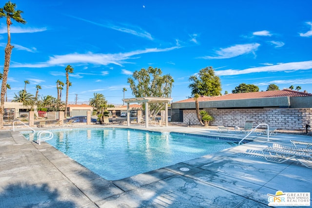 view of swimming pool with a patio area