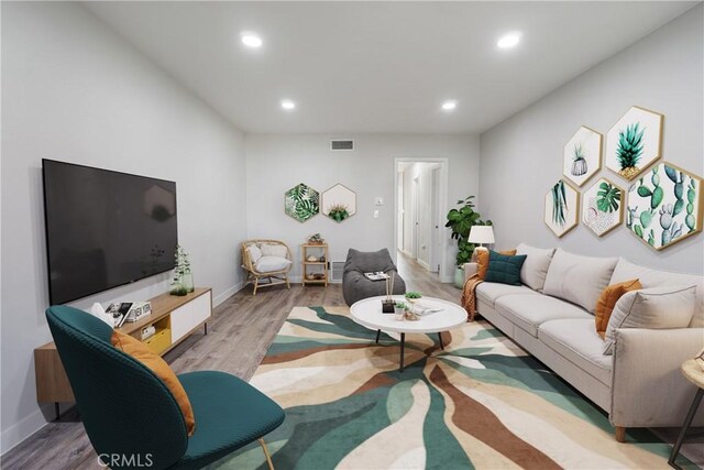 living room with light hardwood / wood-style flooring