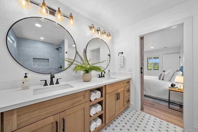 bathroom with a shower and vanity