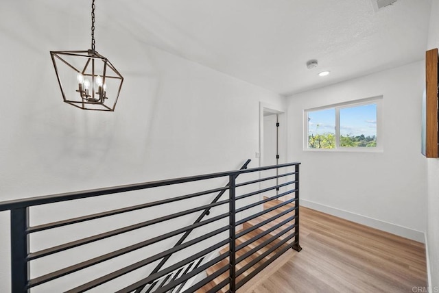 interior space with a chandelier and hardwood / wood-style flooring