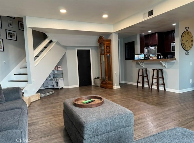 living room featuring dark hardwood / wood-style flooring