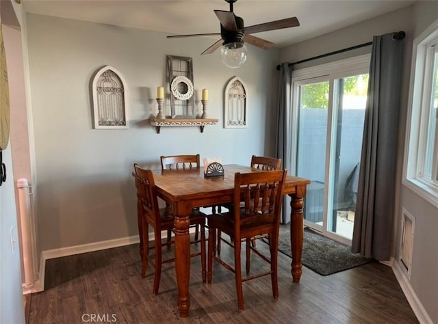 dining space featuring ceiling fan and dark hardwood / wood-style floors