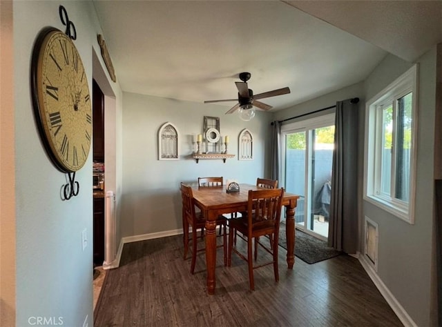 dining area featuring ceiling fan and dark hardwood / wood-style flooring