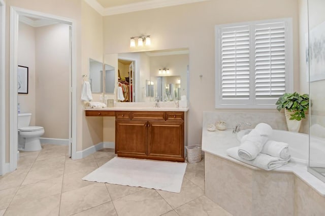 bathroom featuring tile patterned flooring, vanity, a relaxing tiled tub, ornamental molding, and toilet