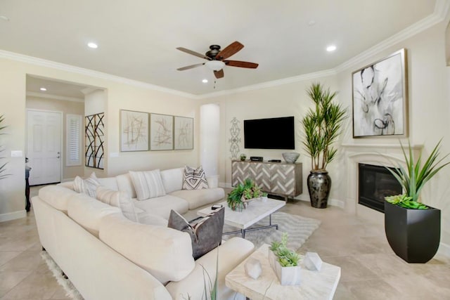 living room featuring crown molding and ceiling fan