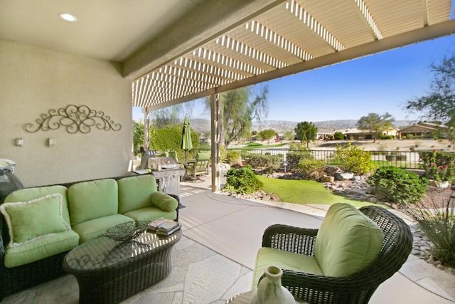 view of patio featuring a mountain view, a pergola, and outdoor lounge area