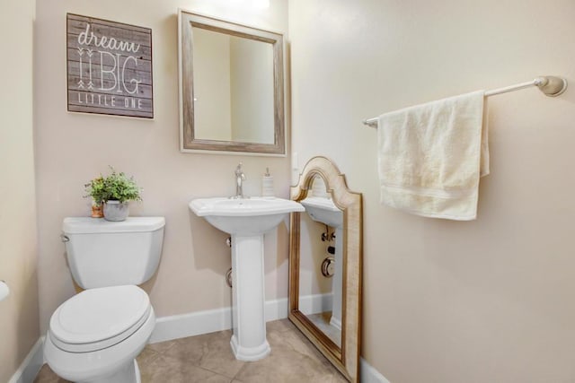 bathroom featuring tile patterned floors and toilet