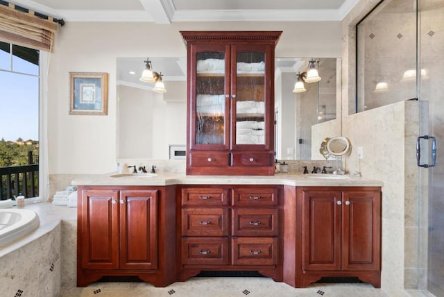 bathroom featuring vanity, ornamental molding, and independent shower and bath