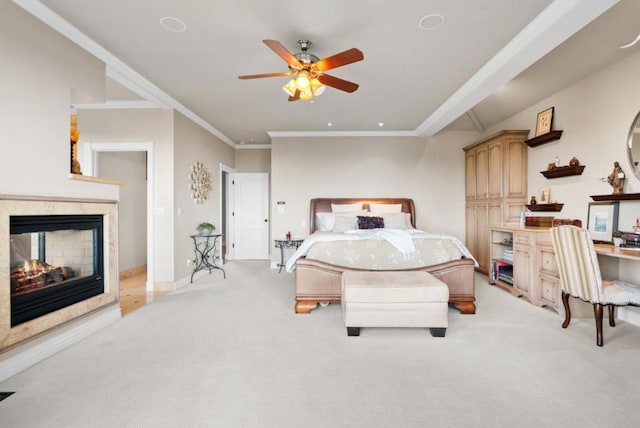 carpeted bedroom with a multi sided fireplace and ornamental molding